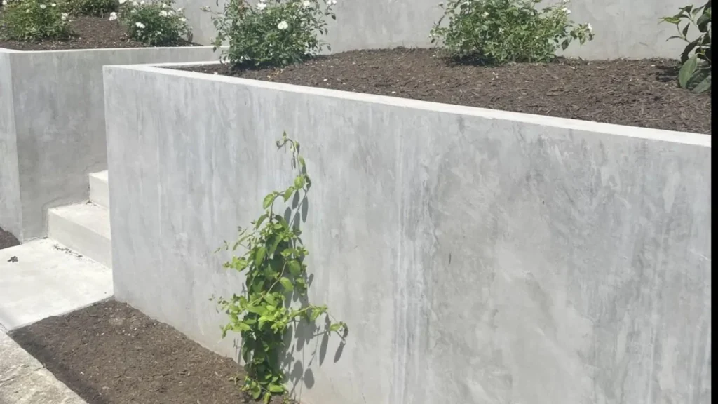 Best concrete retaining walls company in Christchurch building clean concrete garden walls with raised beds
